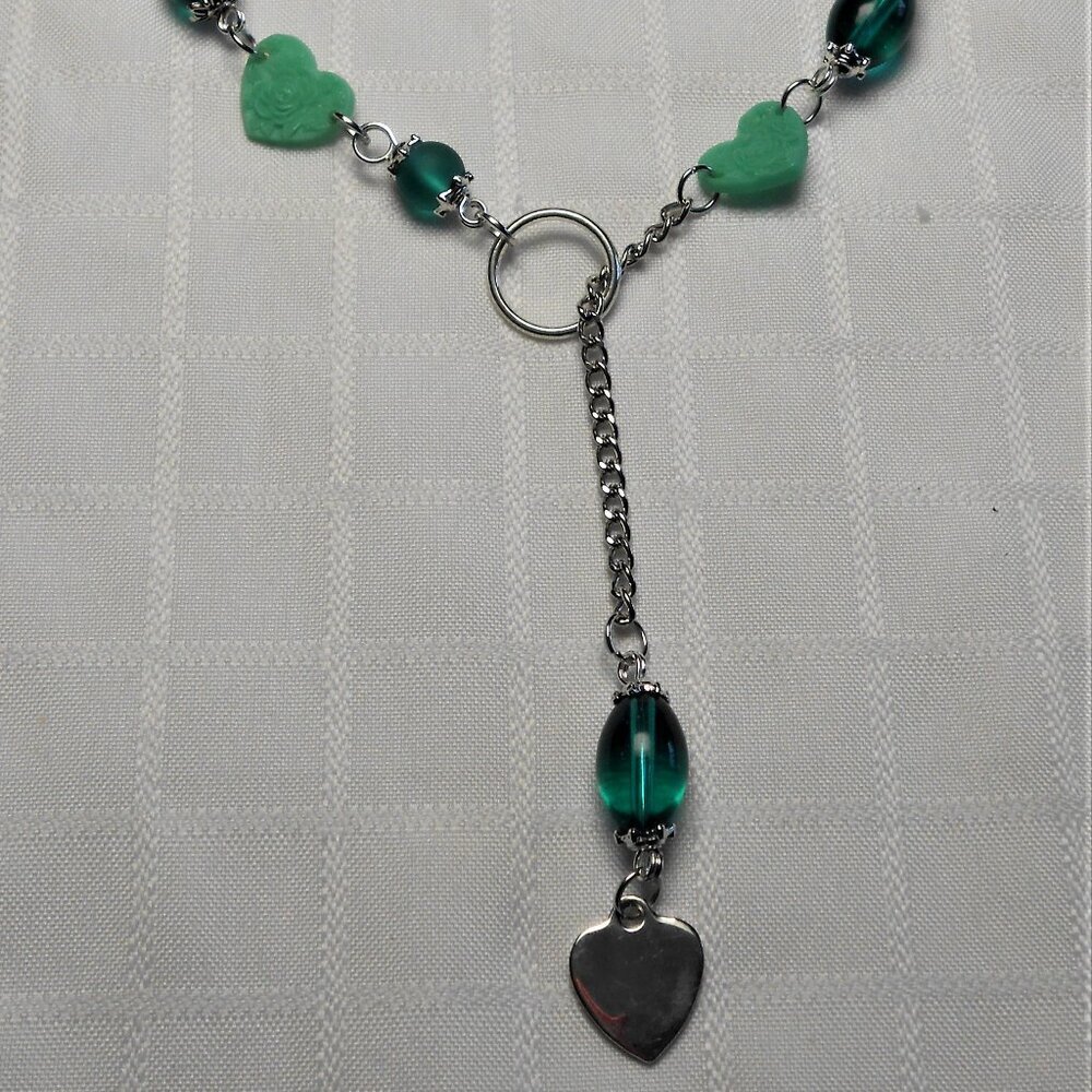 No 556 Handmade necklace with heart-shape acrylic beads with floral embossing